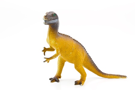 Toy plastic dinosaur on white baclgroundの写真素材