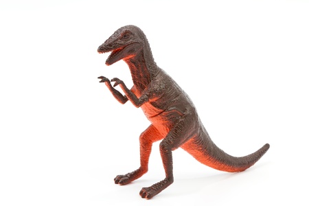 Toy plastic dinosaur on white baclgroundの写真素材