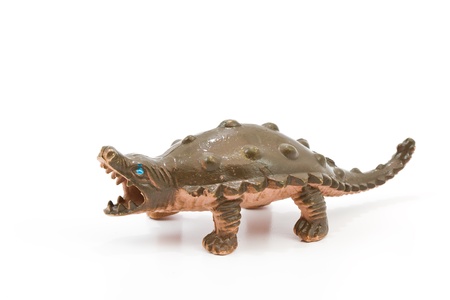 Toy plastic dinosaur on white baclgroundの写真素材