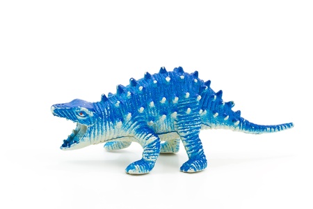 Toy plastic dinosaur on white baclgroundの写真素材