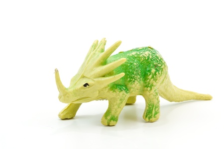 Toy plastic dinosaur on white baclgroundの写真素材