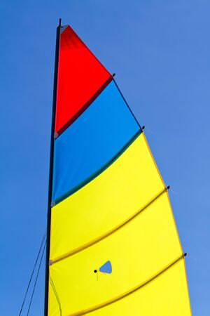 sail exposed against a brilliant blue skyの写真素材