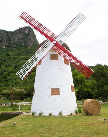 red vintage wind mill in the parkの写真素材
