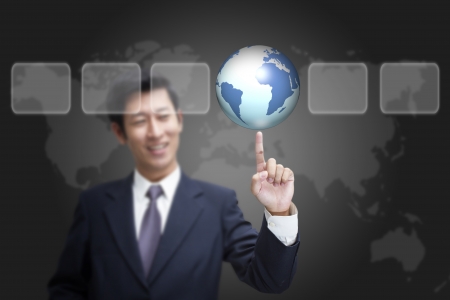 businessman pressing globe ,touch screen buttonの写真素材