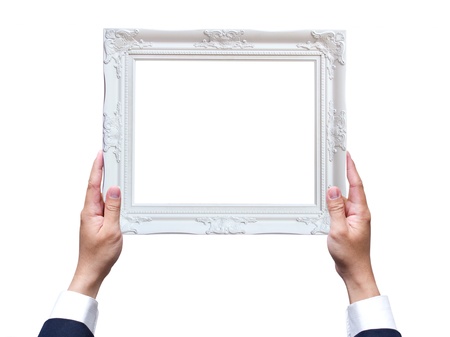 Hand holding wooden frame isolated on white