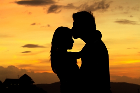  romantic Scene of love couples partners on the Beach before sunsetの写真素材