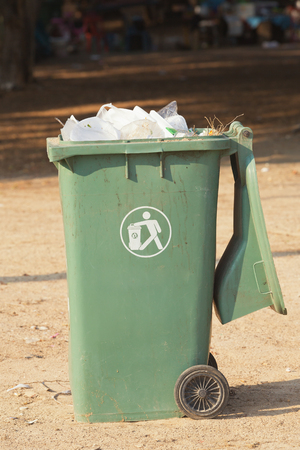 Plastic trashcan, full with the waste bagsの写真素材