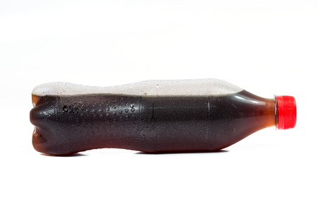 bottle of cola soda isolated on a white backgroundの写真素材