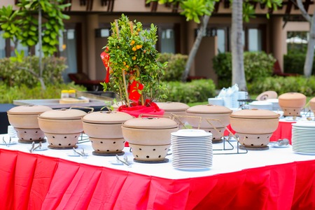 Buffet heated clay pot ready for serviceの写真素材