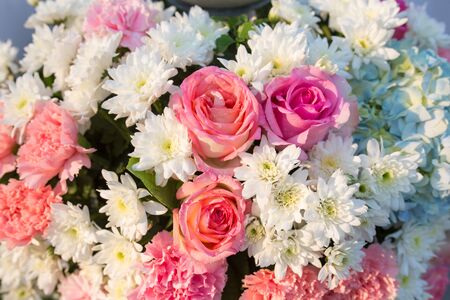wedding bouquet with rose bush, Ranunculus asiaticus as a background