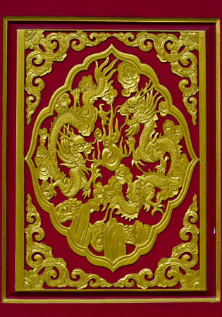 The golden dragon sculpture  Stuck to the wallの写真素材