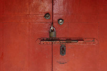 Key in a wooden door の写真素材