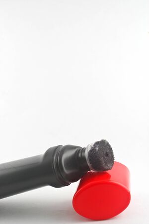Black plastic bottle red cap on white background  Black plastic bottleの写真素材