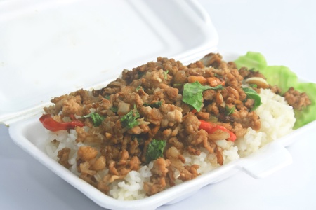 Basil Fried Rice with Pork  Basil fried rice with pork and white foam boxの写真素材