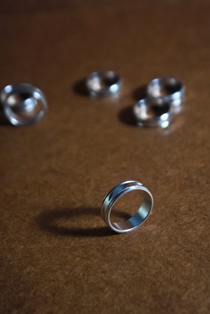 Silver ring on old brown background  Silver ring 