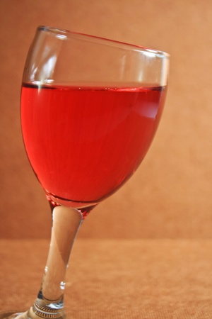 Red wine on vintage brown background の写真素材