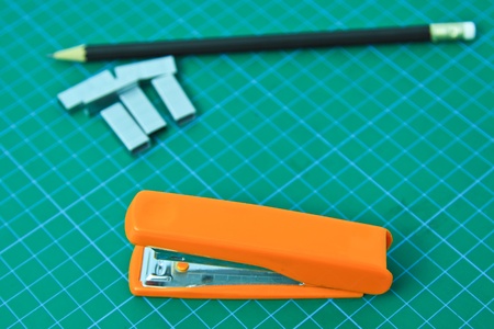 Blank note and stapler on Cutting mat の写真素材