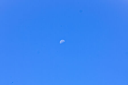 Half moon on blue skyの写真素材
