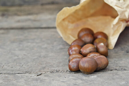 Hazelnuts on old wooden background の写真素材