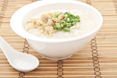 Traditional thai porridge rice gruel in white bowl, congee.の写真素材