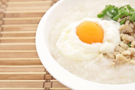 Traditional thai porridge rice gruel in white bowl, congee.