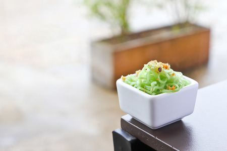 green noodle with Fried garlic in white cup.の写真素材