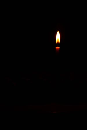 Light of candles on back background.の写真素材