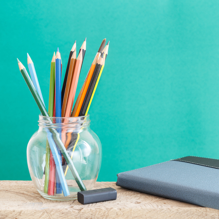 Educational Equipment on the student desk and the chalkboard background. Education Concept.の写真素材