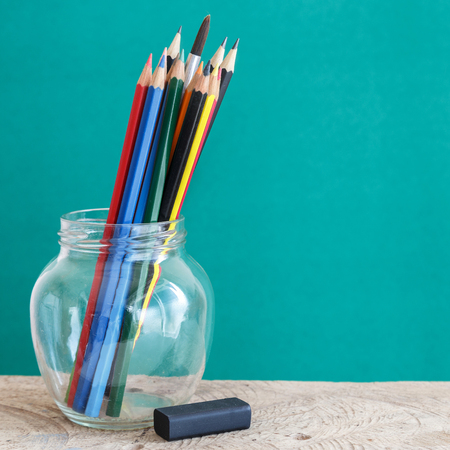 Educational Equipment on the student desk and the chalkboard background. Education Concept.の写真素材