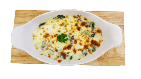 Baked Spinach with Cheese in white plateの写真素材