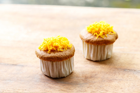 Cup cake on wooden table.の写真素材