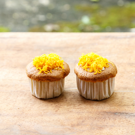 Cup cake on wooden table.の写真素材