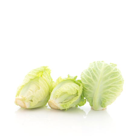 Small green cabbage isolated on white backgroundの写真素材