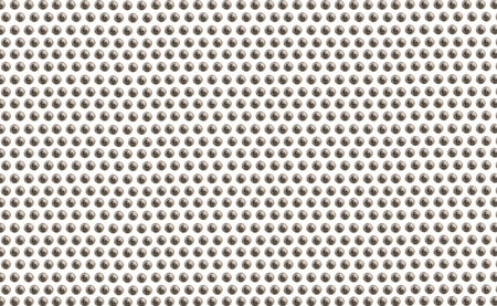 Metal texture of perforated sheet of paper close-up.の写真素材