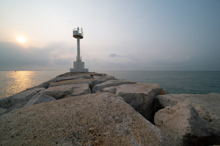 A signal buoy for ships is located on the breakwater.の写真素材