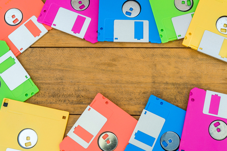 Old diskette on wood textureの写真素材