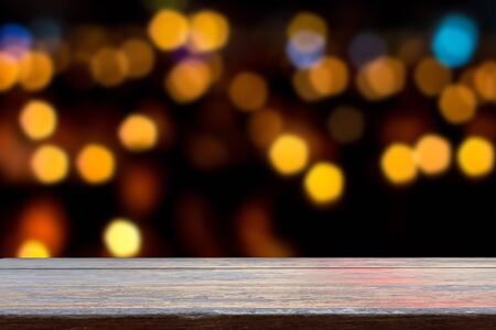 empty wooden shelves on blur bokeh backgroundの写真素材
