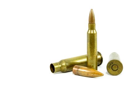 The ammunition was used. And it has not been used. Has a white backgroundの写真素材