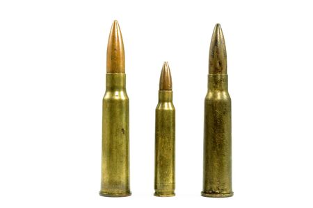 The ammunitions are laid out in small and large blocks, placed on the floor with a white background.の写真素材