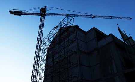Construction site with cranes on sky backgroundのeditorial素材