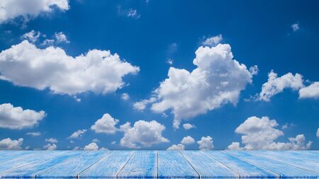 Wood table top on blue sky. Abstract background.の写真素材