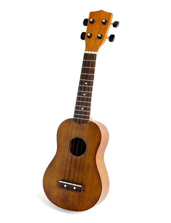The brown ukulele on the white backgroundの写真素材