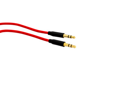 Red aux audio cable isolated on white background.の写真素材