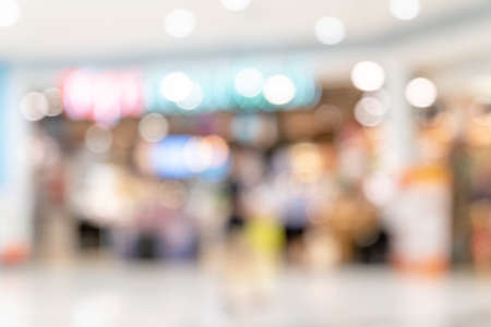 Abstract blur lighting bokeh shopping mall interior of department store for background and backdrop.の写真素材