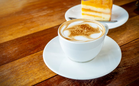 White coffee cup, Latte coffee on wooden table in coffee shop, with empty space for text. concept relaxの写真素材