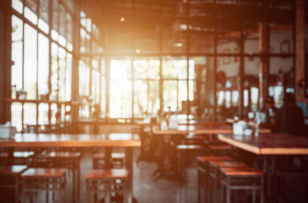 Abstract blurred background in coffee shop, with empty space for text.の写真素材