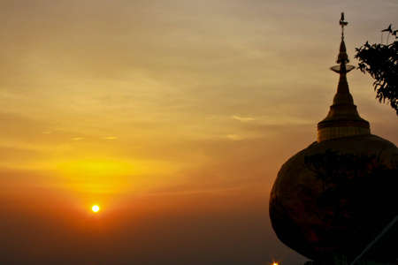 beauty sunset and gold pagodaの写真素材