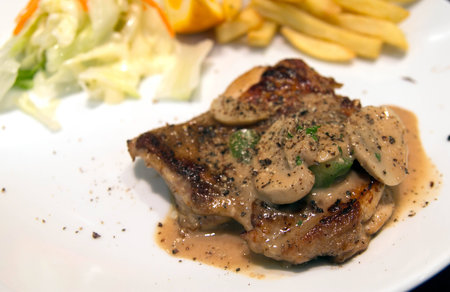 steak and mushroom sauce on  white dishの写真素材