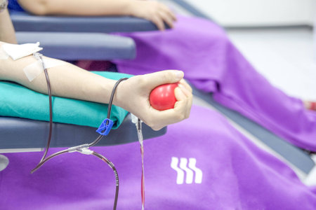 hand hold and pump ball for blood donateの写真素材