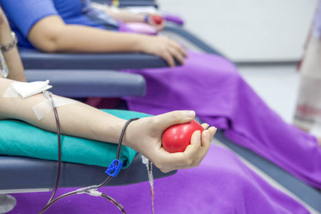 hand hold and pump ball for blood donateの写真素材